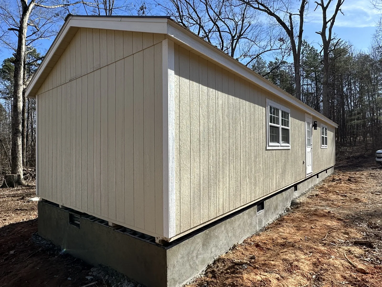 Storage shed set on a freshly graded pad